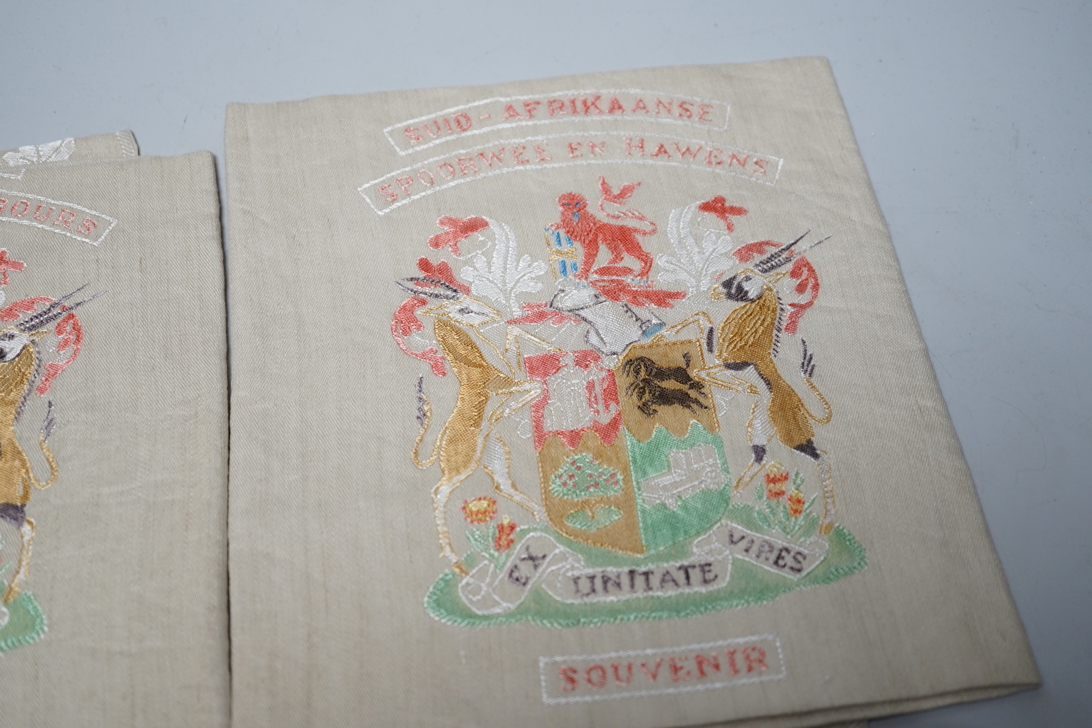 Two South African late 19th century damask railway napkins and a velvet rugby or cricketing cap